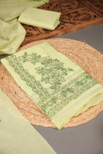 Load image into Gallery viewer, Floral Silhouettes Green Muga Cotton Unstitched Suit Set