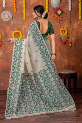 Parnita Beige & Bottle Green Muga Cotton Jamdani Saree