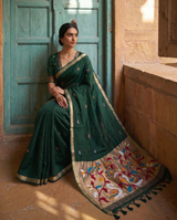 Sanjana Dark Green Muga Silk Saree With Unstitched Blouse Piece