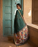 Sanjana Dark Green Muga Silk Saree With Unstitched Blouse Piece